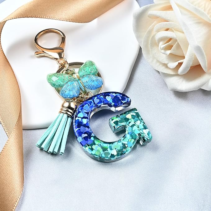 JINGUAZI Initial letter Keychains for Women Tassel Butterfly Pink Purple Cute Car Keychain for Wallet Backpack bag charm