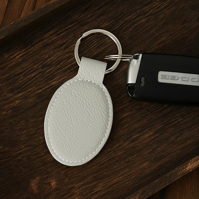 LaserGram Oval Keychain, Golfer Golfing, Personalized Engraving Included (White with Silver)